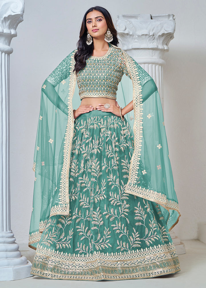 Buy Now Turquoise Net Embroidered Wedding Festive Lehenga Choli Online in USA, UK, Canada, UAE & Worldwide at Empress Clothing. 