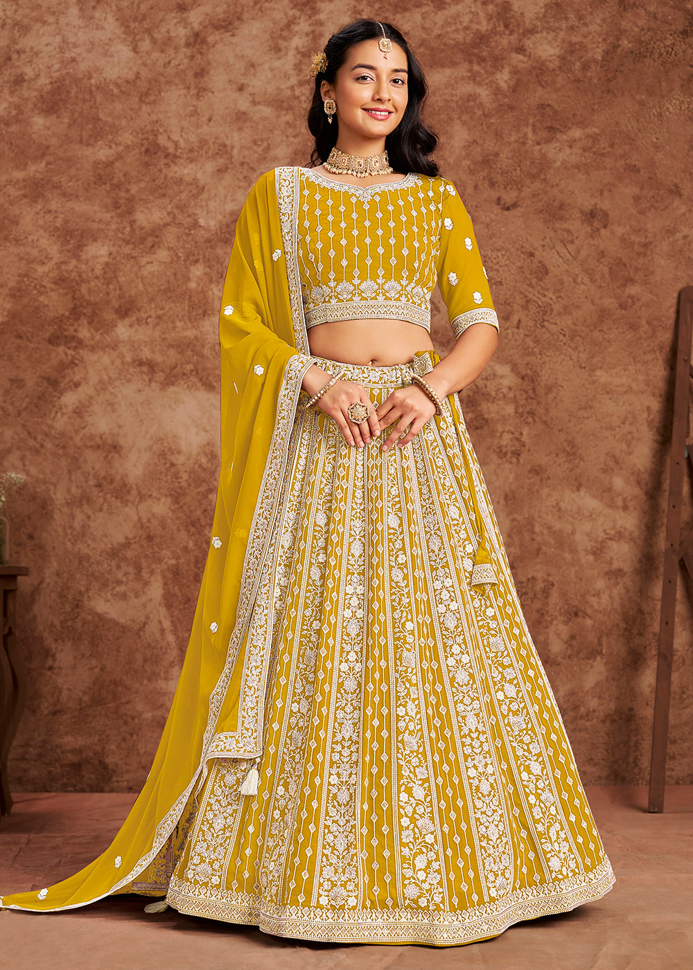 Buy Now Faux Georgette Yellow Color Embroidered Lehenga Choli Online in USA, UK, Canada, UAE & Worldwide at Empress Clothing. 