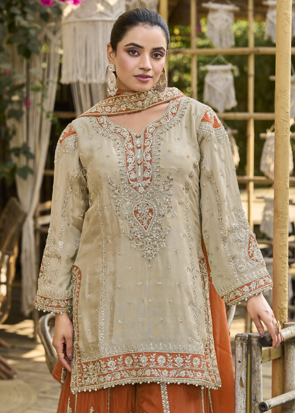 Buy Now Dusty Cream & Orange Heavy Chinnon Palazzo Style Suit Online in US, UK, Canada, Netherlands, Germany, Italy, France, Sweden, UAE & Worldwide at Empress.