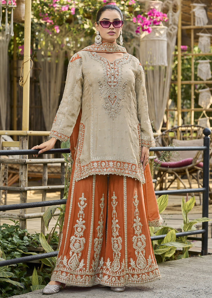 Buy Now Dusty Cream & Orange Heavy Chinnon Palazzo Style Suit Online in US, UK, Canada, Netherlands, Germany, Italy, France, Sweden, UAE & Worldwide at Empress.