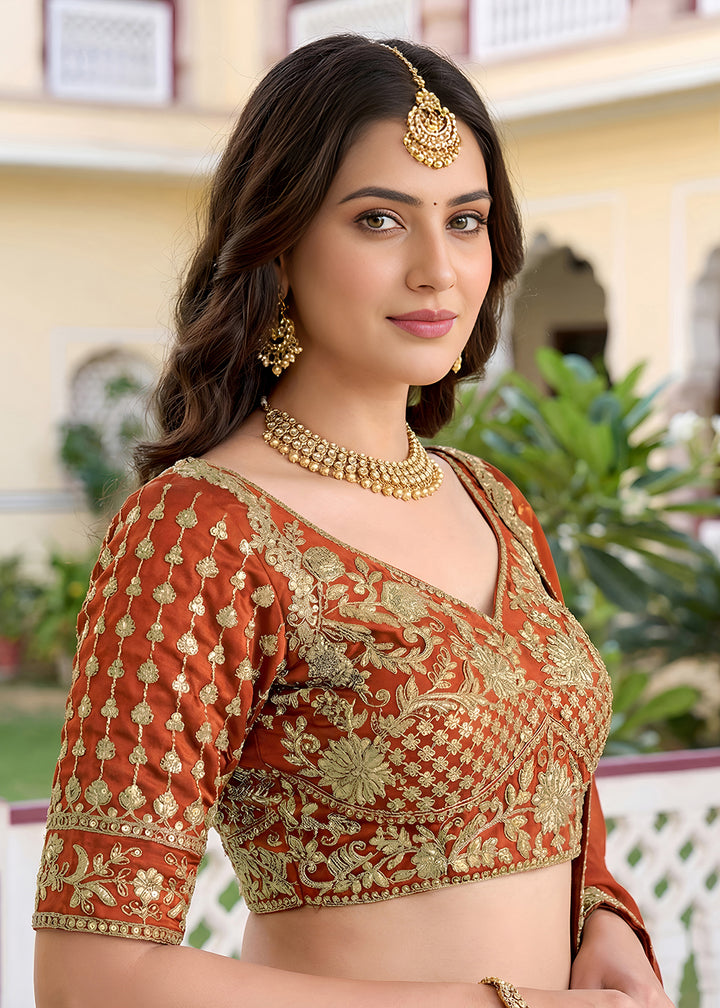 Buy Now Orange Rangoli Silk Zari &amp; Threads Festive Lehenga Choli Online in US, UK, Canada, France, Italy, Germany, Sweden, UAE &amp; Worldwide at Empress Clothing.