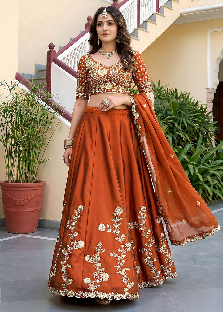 Buy Now Orange Rangoli Silk Zari &amp; Threads Festive Lehenga Choli Online in US, UK, Canada, France, Italy, Germany, Sweden, UAE &amp; Worldwide at Empress Clothing.