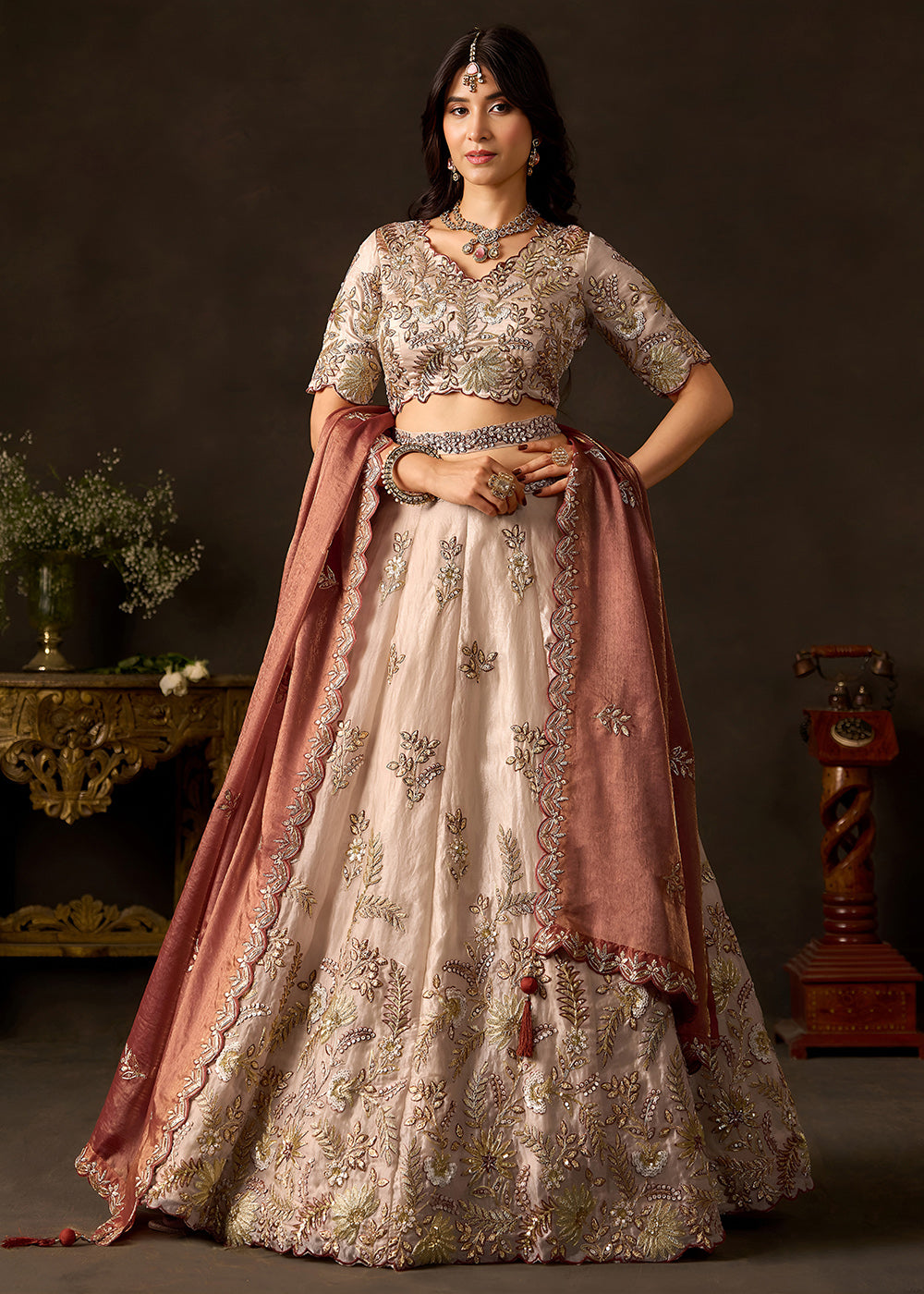 Shop Now Beige Gold Wedding Lehenga Choli with Copper Dupatta Online in USA, UK, Canada, France, Germany, Spain, Austria, Sweden, UAE & Worldwide at Empress.