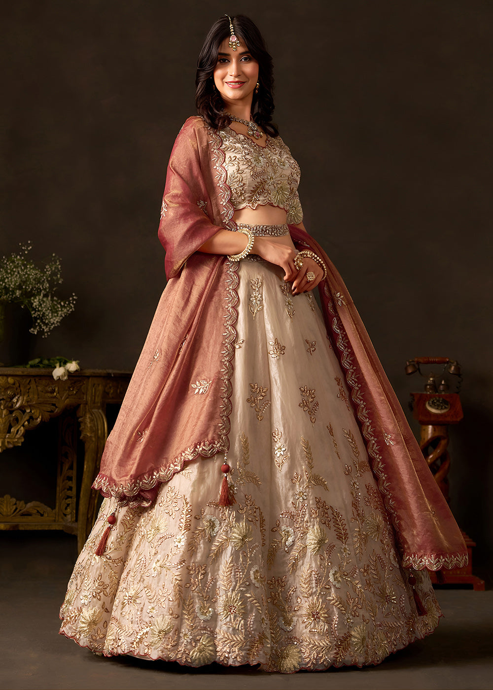 Shop Now Beige Gold Wedding Lehenga Choli with Copper Dupatta Online in USA, UK, Canada, France, Germany, Spain, Austria, Sweden, UAE &amp; Worldwide at Empress.
