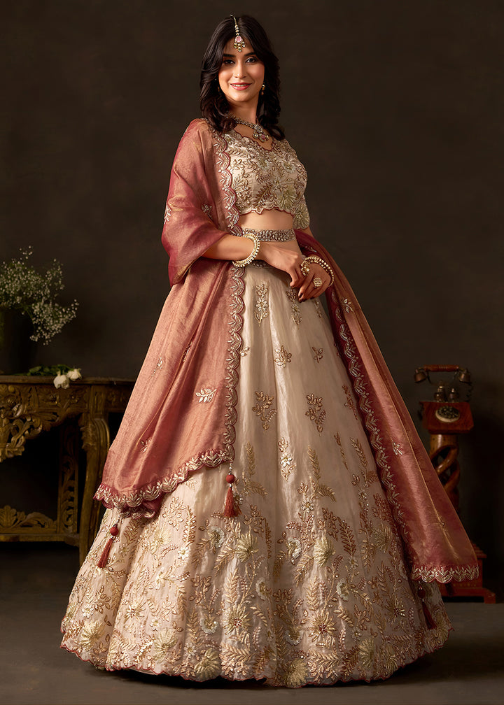 Shop Now Beige Gold Wedding Lehenga Choli with Copper Dupatta Online in USA, UK, Canada, France, Germany, Spain, Austria, Sweden, UAE &amp; Worldwide at Empress.