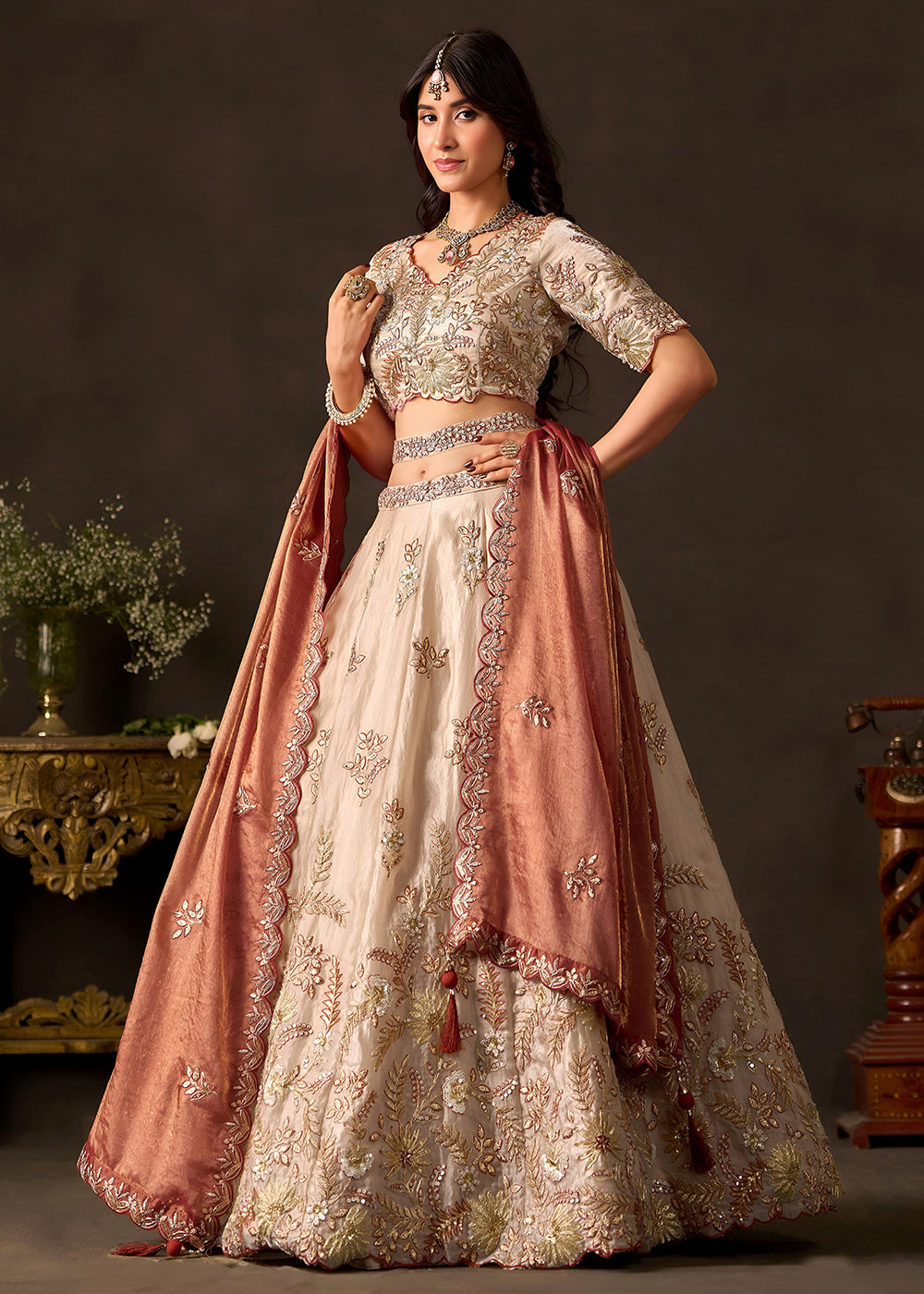 Shop Now Beige Gold Wedding Lehenga Choli with Copper Dupatta Online in USA, UK, Canada, France, Germany, Spain, Austria, Sweden, UAE &amp; Worldwide at Empress.