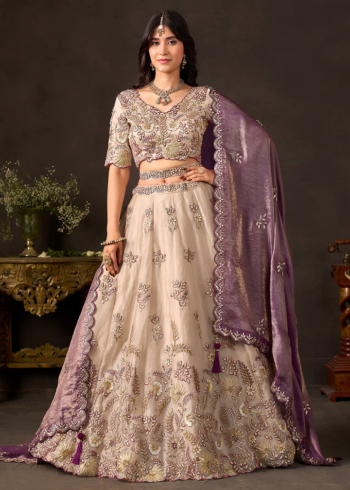 Shop Now Beige Gold Wedding Lehenga Choli with Purple Dupatta Online in USA, UK, Canada, France, Germany, Spain, Austria, Sweden, UAE &amp; Worldwide at Empress.