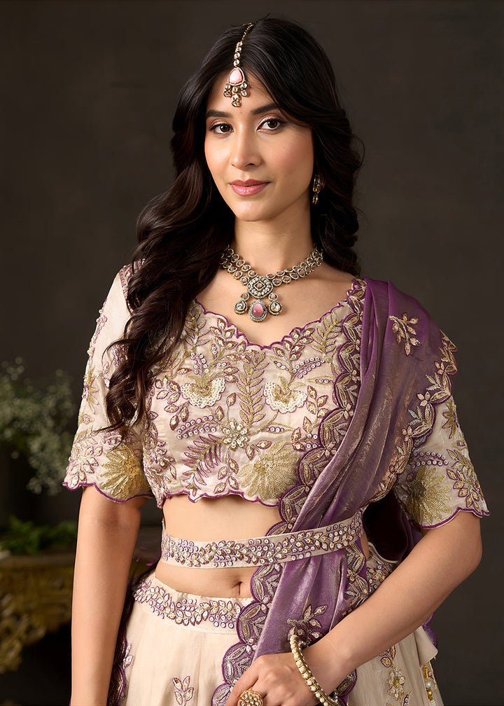 Shop Now Beige Gold Wedding Lehenga Choli with Purple Dupatta Online in USA, UK, Canada, France, Germany, Spain, Austria, Sweden, UAE &amp; Worldwide at Empress.