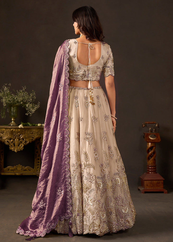 Shop Now Beige Gold Wedding Lehenga Choli with Purple Dupatta Online in USA, UK, Canada, France, Germany, Spain, Austria, Sweden, UAE &amp; Worldwide at Empress.