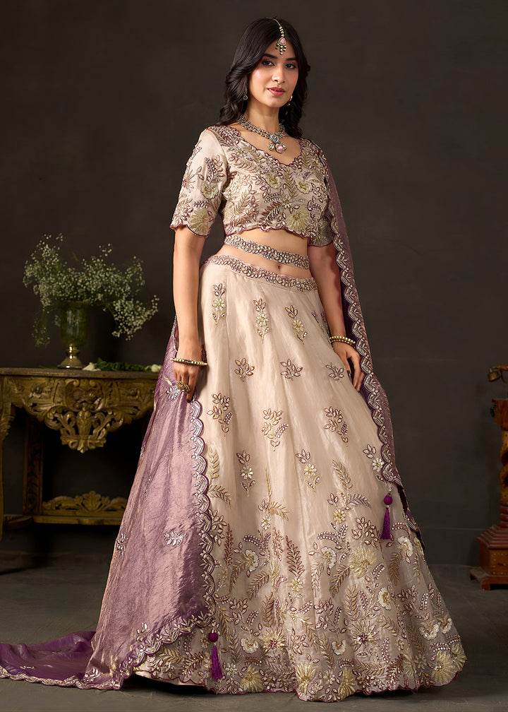 Shop Now Beige Gold Wedding Lehenga Choli with Purple Dupatta Online in USA, UK, Canada, France, Germany, Spain, Austria, Sweden, UAE &amp; Worldwide at Empress.