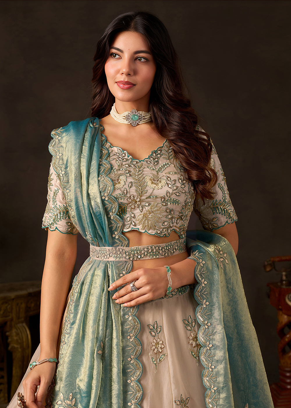 Shop Now Beige Gold Wedding Lehenga Choli with Teal Dupatta Online in USA, UK, Canada, France, Germany, Spain, Austria, Sweden, UAE & Worldwide at Empress.