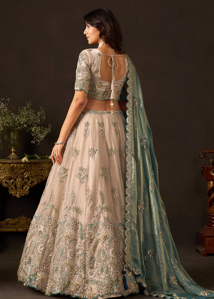 Shop Now Beige Gold Wedding Lehenga Choli with Teal Dupatta Online in USA, UK, Canada, France, Germany, Spain, Austria, Sweden, UAE &amp; Worldwide at Empress.