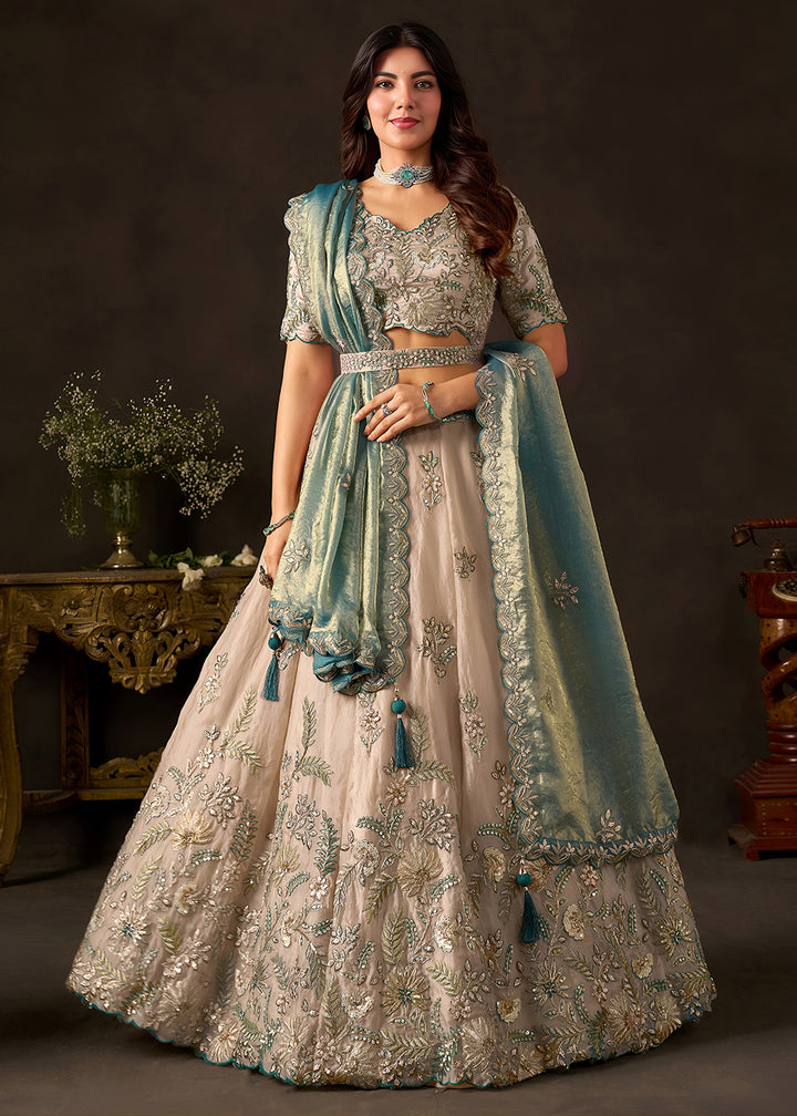 Shop Now Beige Gold Wedding Lehenga Choli with Teal Dupatta Online in USA, UK, Canada, France, Germany, Spain, Austria, Sweden, UAE &amp; Worldwide at Empress.