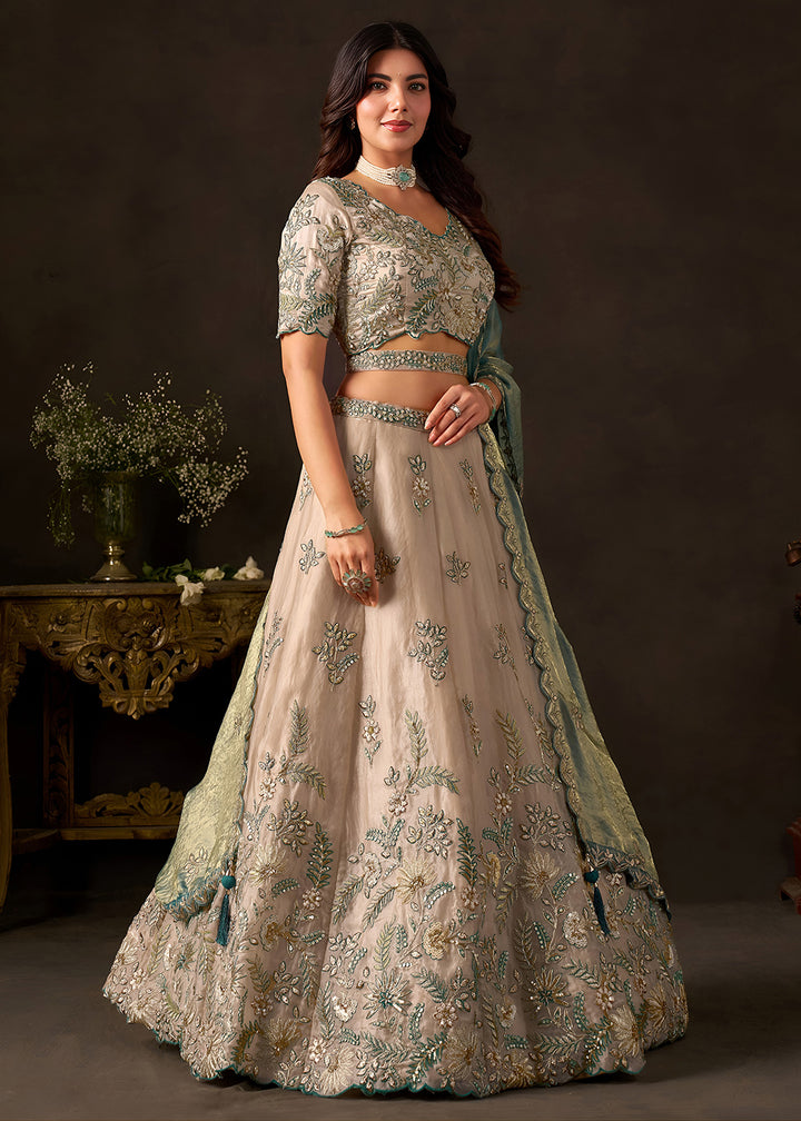 Shop Now Beige Gold Wedding Lehenga Choli with Teal Dupatta Online in USA, UK, Canada, France, Germany, Spain, Austria, Sweden, UAE &amp; Worldwide at Empress.