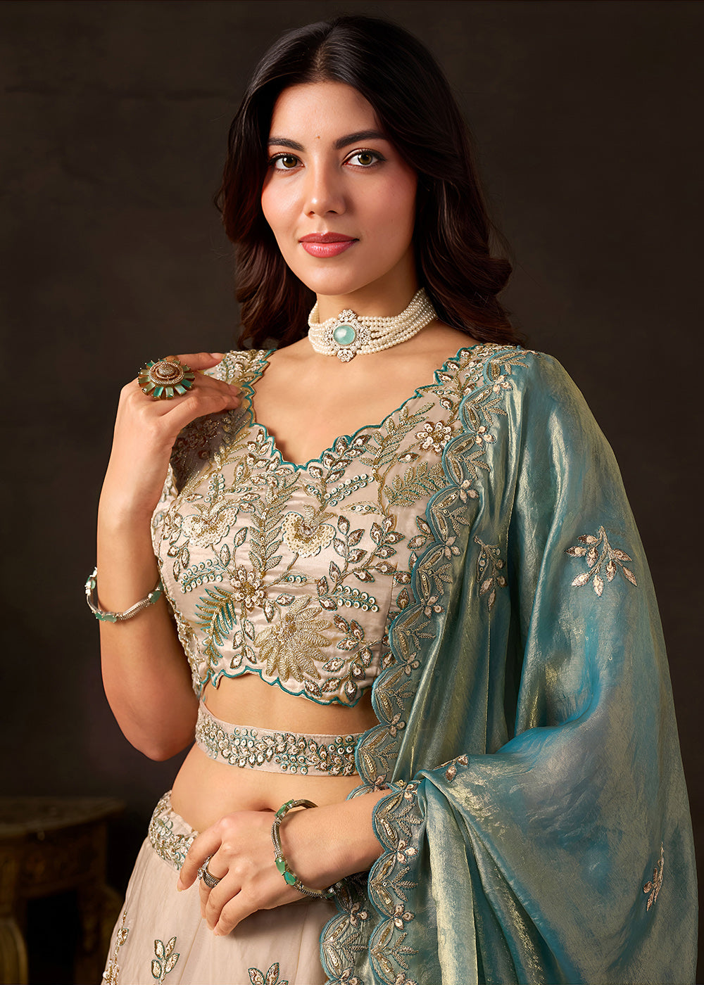 Shop Now Beige Gold Wedding Lehenga Choli with Teal Dupatta Online in USA, UK, Canada, France, Germany, Spain, Austria, Sweden, UAE &amp; Worldwide at Empress.