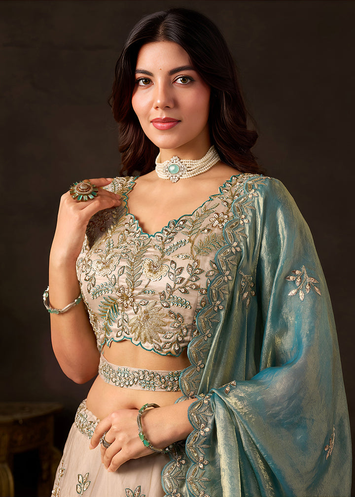 Shop Now Beige Gold Wedding Lehenga Choli with Teal Dupatta Online in USA, UK, Canada, France, Germany, Spain, Austria, Sweden, UAE &amp; Worldwide at Empress.