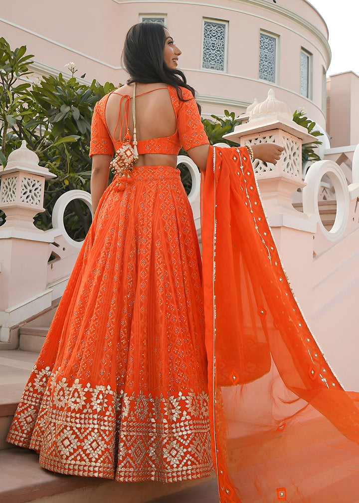 Buy Now Wedding Festive Wear Orange Designer Lehenga Choli Online in US, UK, Canada, France, Italy, Germany, Australia, Greece, UAE &amp; Worldwide at Empress.