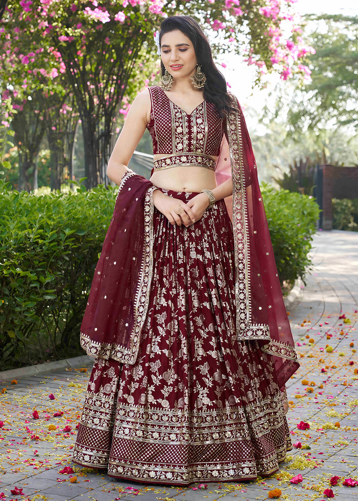Buy Now Maroon Dola Silk Jacquard Festive Party Lehenga Choli Online in USA, UK, Canada, France, Italy, Germany, Australia, UAE & Worldwide at Empress Clothing.