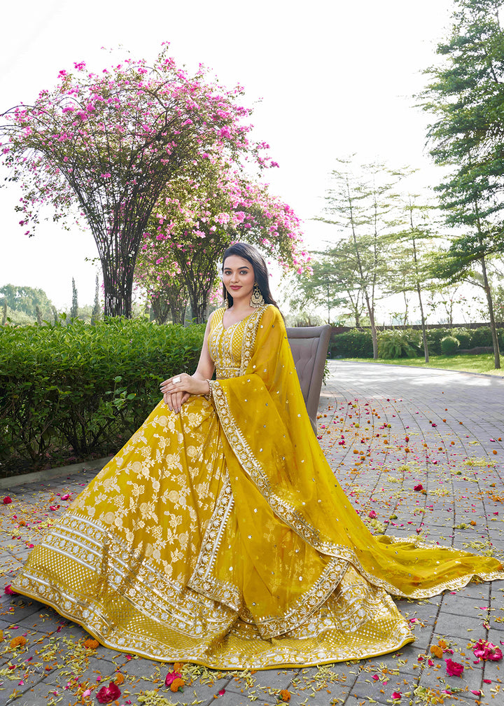 Buy Now Yellow Dola Silk Jacquard Festive Party Lehenga Choli Online in USA, UK, Canada, France, Italy, Germany, Australia, UAE & Worldwide at Empress Clothing.