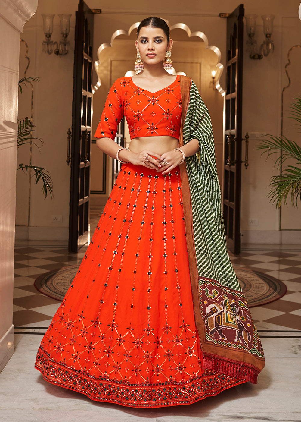 Buy Now Enchanting Sequins Bright Orange Wedding Lehenga Choli Online in USA, UK, Canada & Worldwide at Empress Clothing. 