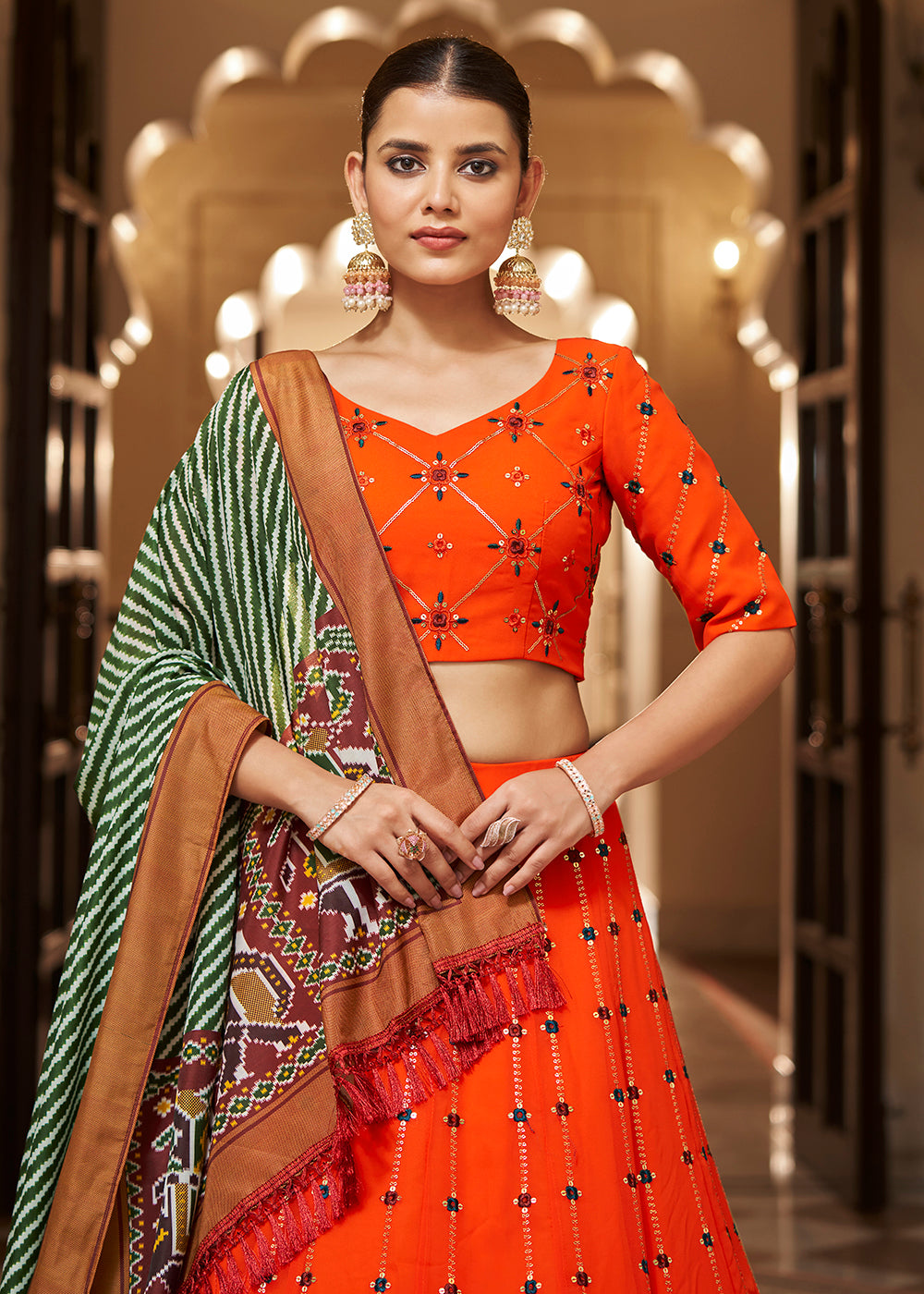 Buy Now Enchanting Sequins Bright Orange Wedding Lehenga Choli Online in USA, UK, Canada & Worldwide at Empress Clothing. 