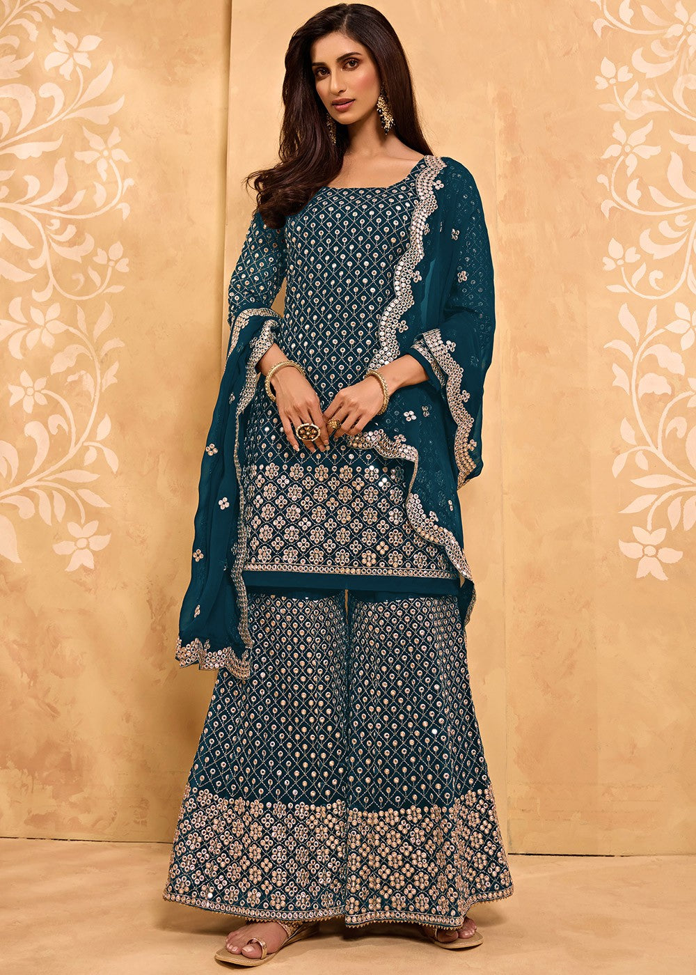 Mesmerizing Peacock Blue Faux Georgette Embroidery & Stone Work Sharara Suit