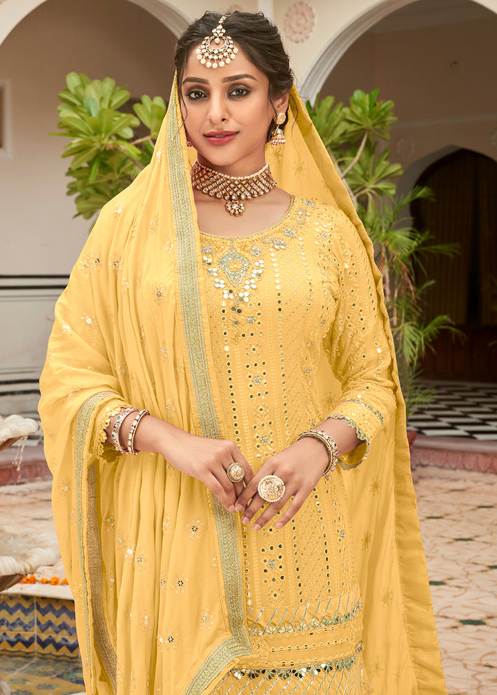 Shop Now Pastel Yellow Mirror Embellished Wedding Wear Sharara Style Suit Online at Empress Clothing in USA, UK, Canada, Germany & Worldwide.