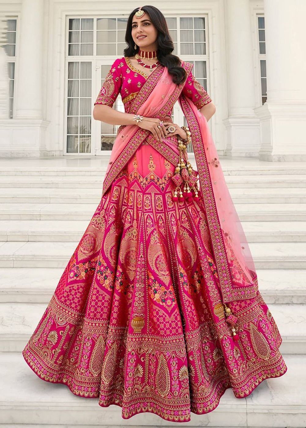 Buy Now Elegant Fuchsia Pink Heavy Embroidered Silk Bridal Lehenga Choli Online in USA, UK, Canada & Worldwide at Empress Clothing. 