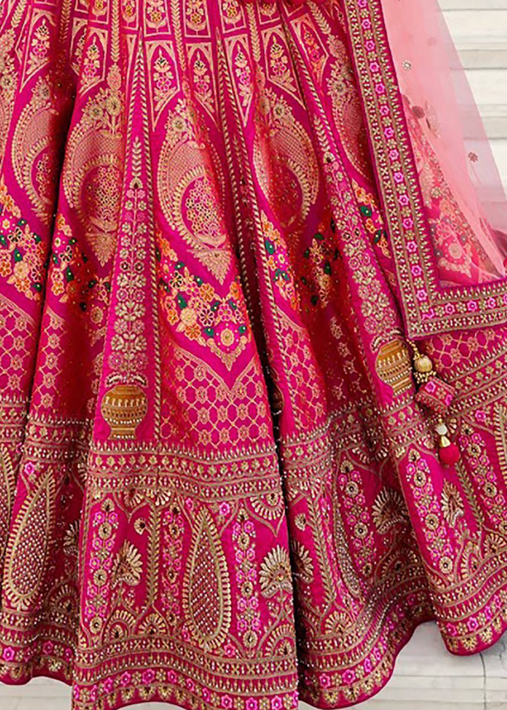 Buy Now Elegant Fuchsia Pink Heavy Embroidered Silk Bridal Lehenga Choli Online in USA, UK, Canada & Worldwide at Empress Clothing. 