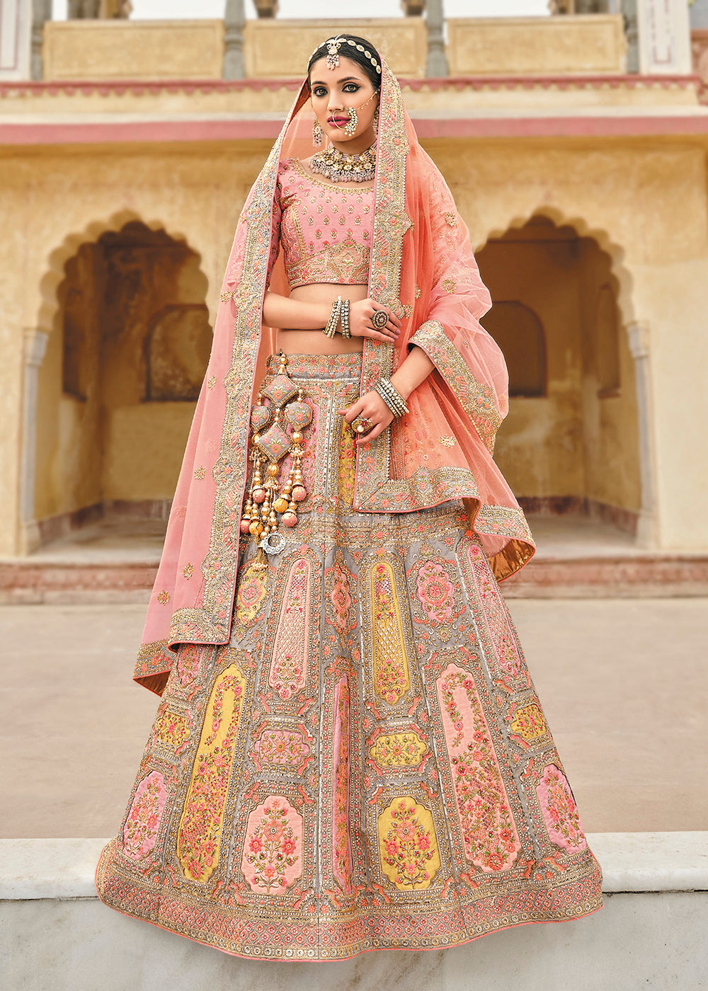 Buy Now Radiant Peach Bridal Wear Heavy Embroidered Silk Lehenga Choli Online in USA, UK, Canada & Worldwide at Empress Clothing.
