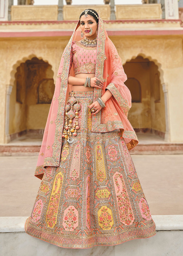 Buy Now Radiant Peach Bridal Wear Heavy Embroidered Silk Lehenga Choli Online in USA, UK, Canada & Worldwide at Empress Clothing.