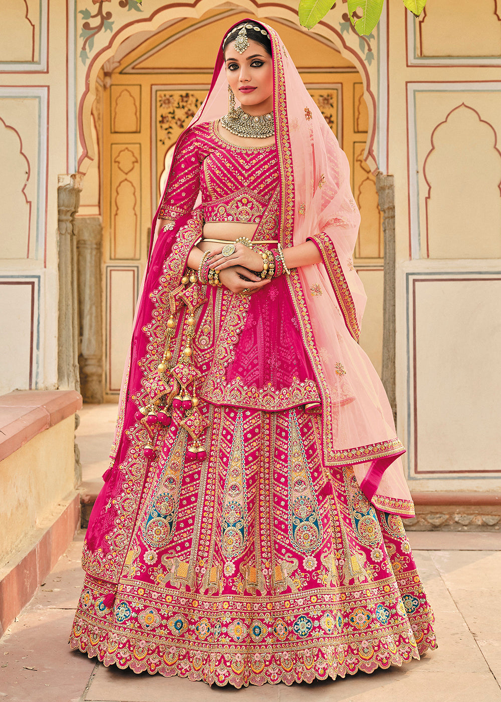 Buy Now Enticing Pink Bridal Wear Heavy Embroidered Silk Lehenga Choli Online in USA, UK, Canada & Worldwide at Empress Clothing.