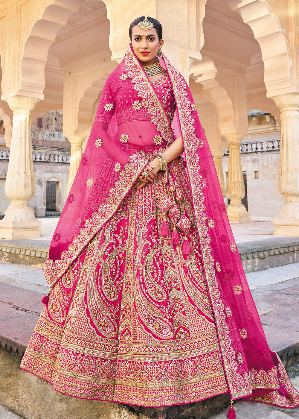 Buy Now Magenta Pink Bridal Wear Heavy Embroidered Silk Lehenga Choli Online in USA, UK, Canada & Worldwide at Empress Clothing.