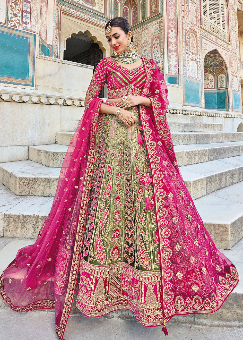 Buy Now Green & Pink Bridal Wear Heavy Embroidered Silk Lehenga Choli Online in USA, UK, Canada & Worldwide at Empress Clothing. 