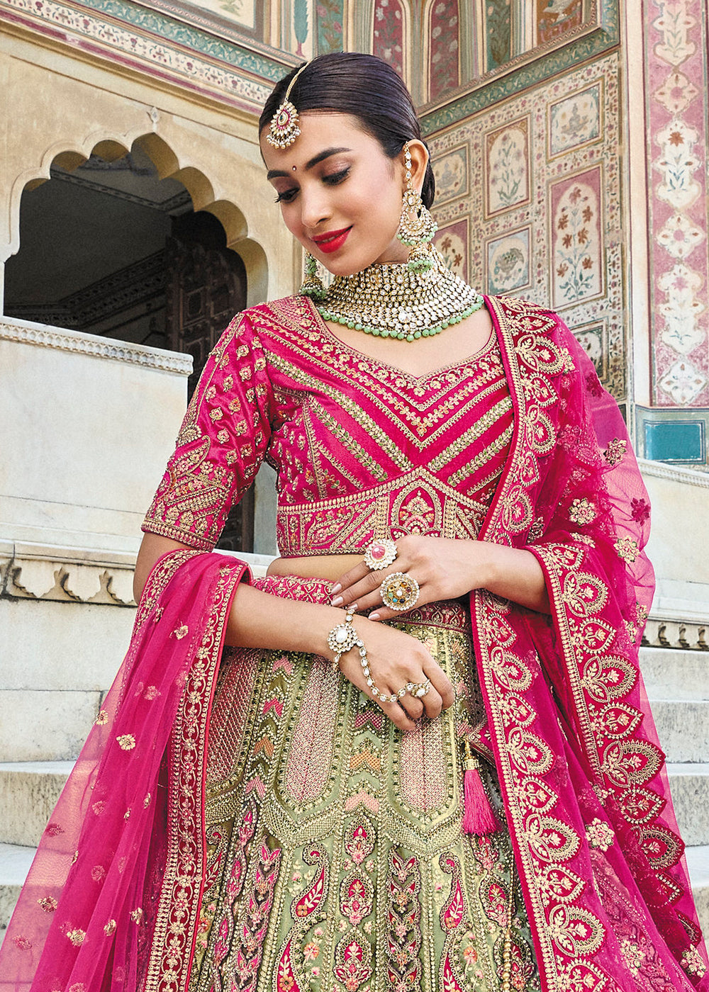Buy Now Green & Pink Bridal Wear Heavy Embroidered Silk Lehenga Choli Online in USA, UK, Canada & Worldwide at Empress Clothing. 