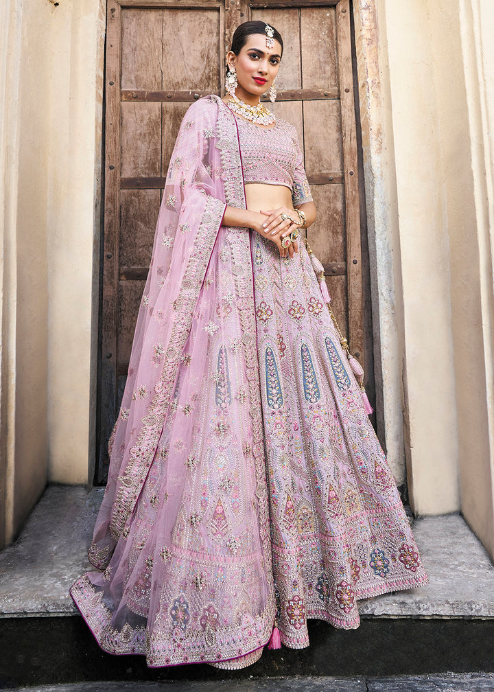 Buy Now Pretty Lavender Bridal Wear Heavy Embroidered Silk Lehenga Choli Online in USA, UK, Canada & Worldwide at Empress Clothing.